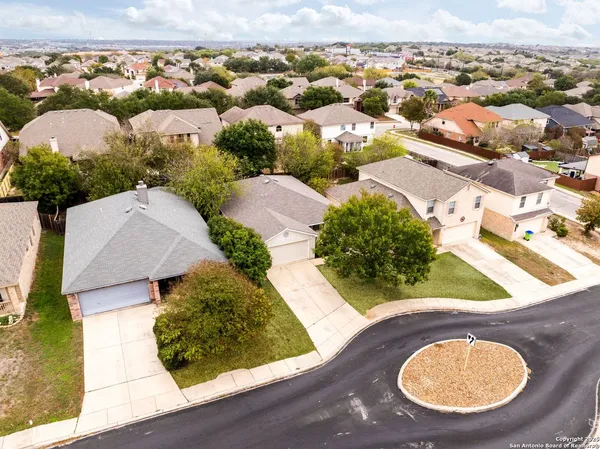 a front view of a house with a yard and sitting area