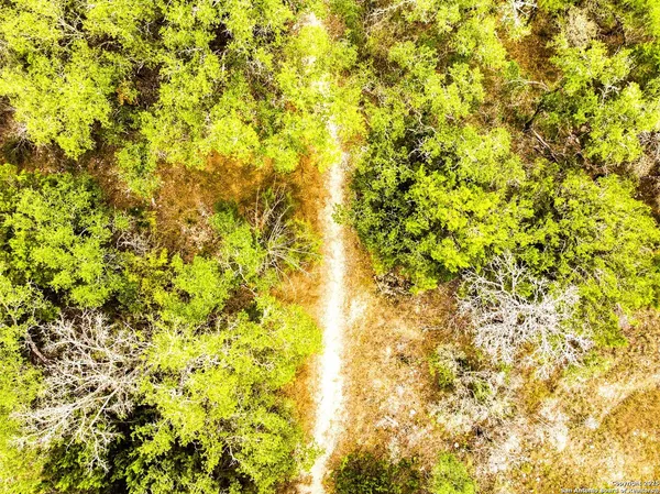 a view of a park with swings and slides
