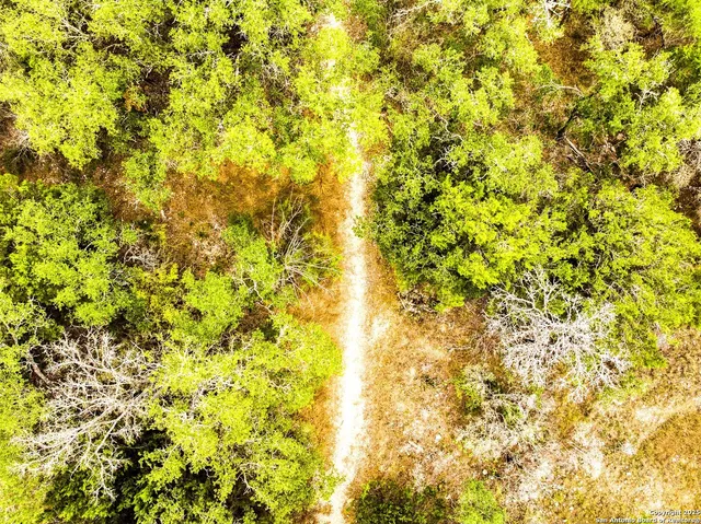 a view of a park with swings and slides
