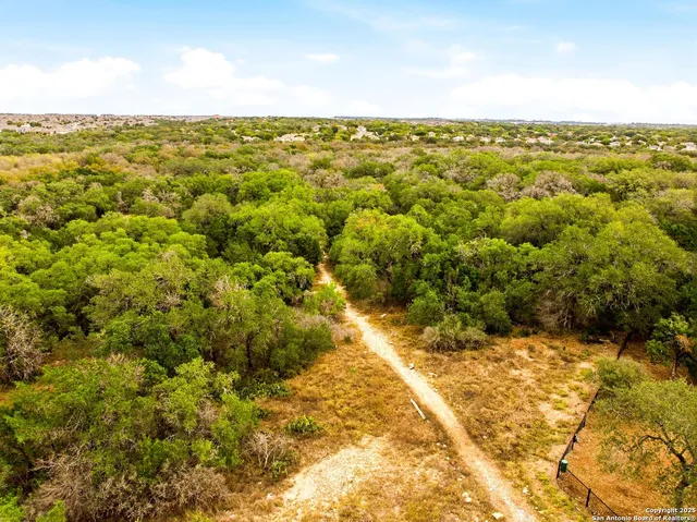 a swimming pool with wooden fence