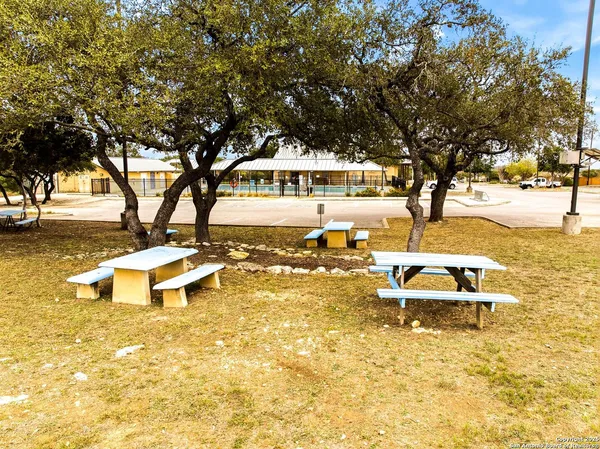 a picture of a bench in front of a window