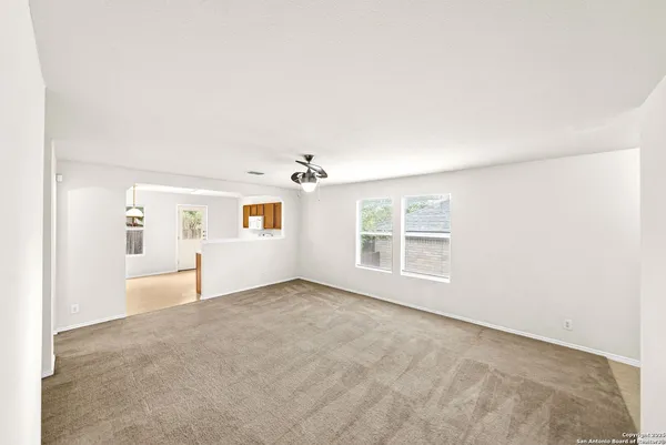 a kitchen with a stove a sink and a refrigerator