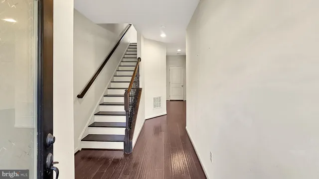 a view of entryway with wooden floor