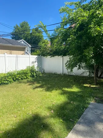 a view of backyard with green space