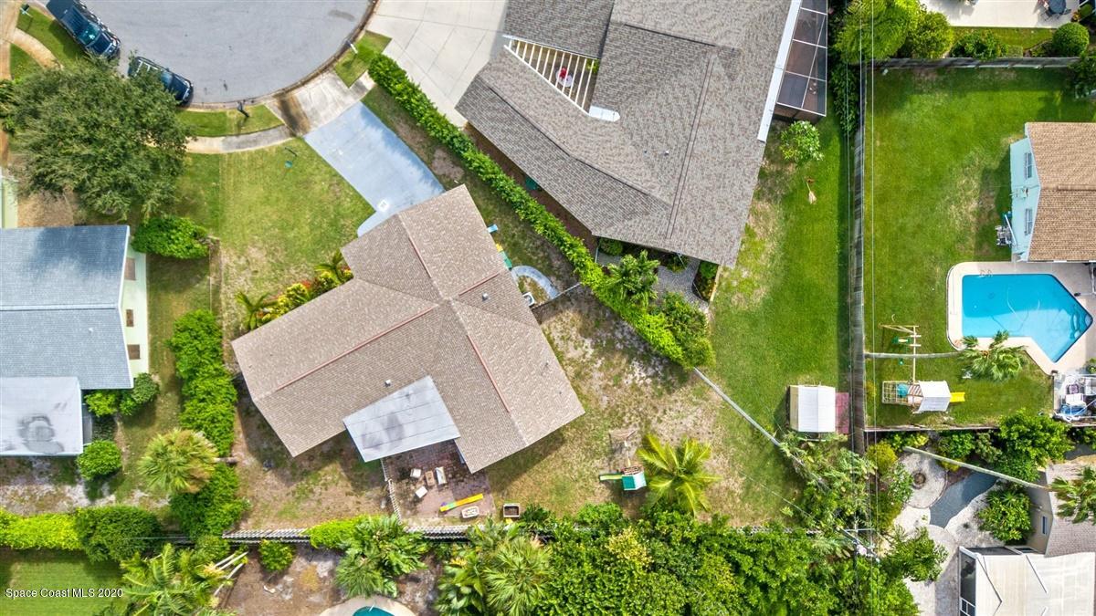 108 Neptune Court Indialantic, FL 32903 - Photo 12 of 33 an aerial view of a house with a garden and lake view