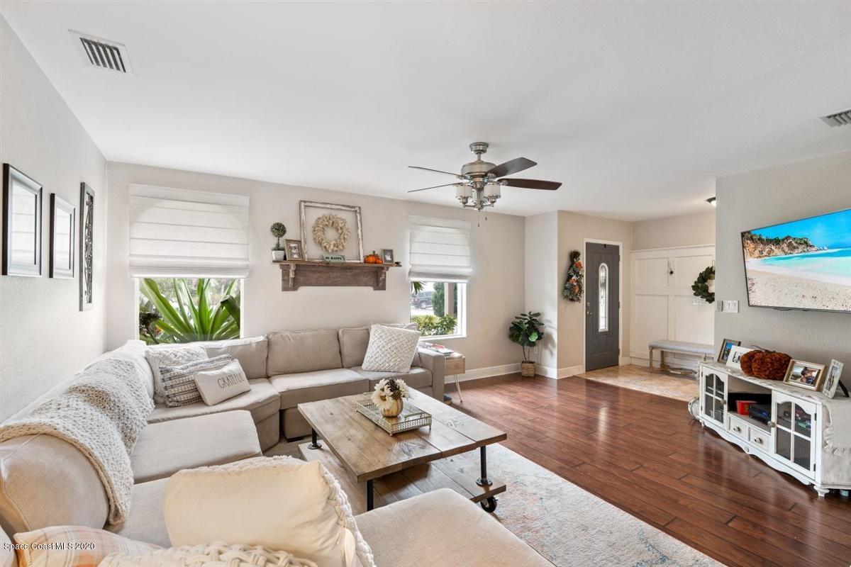 108 Neptune Court Indialantic, FL 32903 - Photo 15 of 33 a living room with furniture and wooden floor