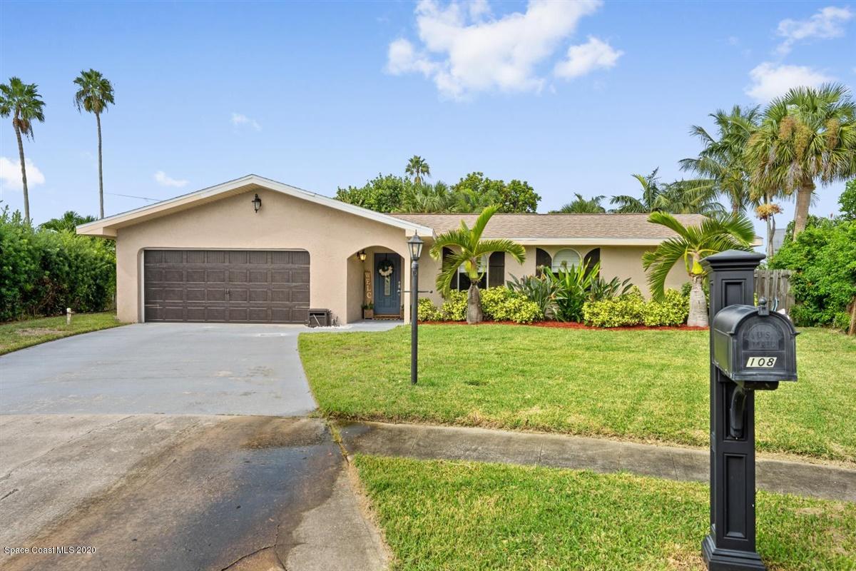 108 Neptune Court Indialantic, FL 32903 - Photo 3 of 33 a front view of a house with garden
