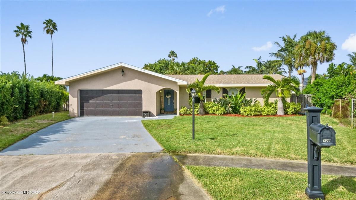 108 Neptune Court Indialantic, FL 32903 - Photo 4 of 33 a front view of a house with garden