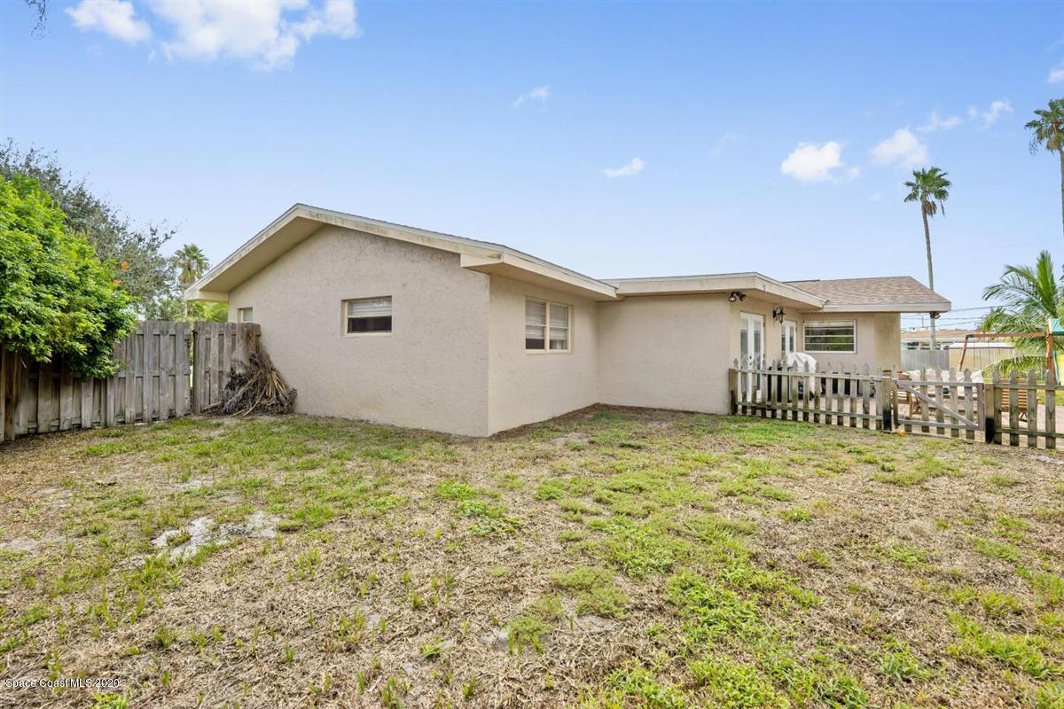 108 Neptune Court Indialantic, FL 32903 - Photo 32 of 33 a house view with a backyard space