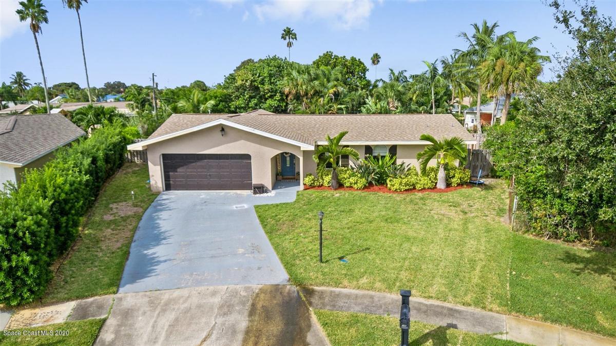 108 Neptune Court Indialantic, FL 32903 - Photo 6 of 33 a front view of a house with garden