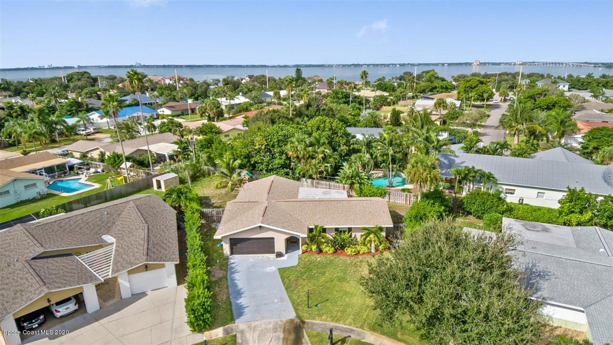 108 Neptune Court Indialantic, FL 32903 - Photo 7 of 33 an aerial view of a house with a yard
