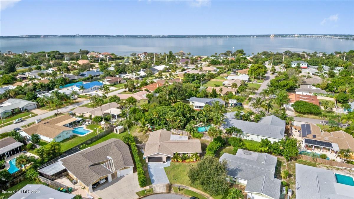 108 Neptune Court Indialantic, FL 32903 - Photo 8 of 33 an aerial view of a building with outdoor space and lake view