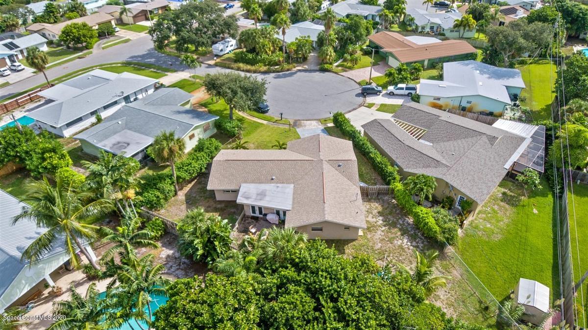 108 Neptune Court Indialantic, FL 32903 - Photo 10 of 33 an aerial view of a house with a garden and swimming pool