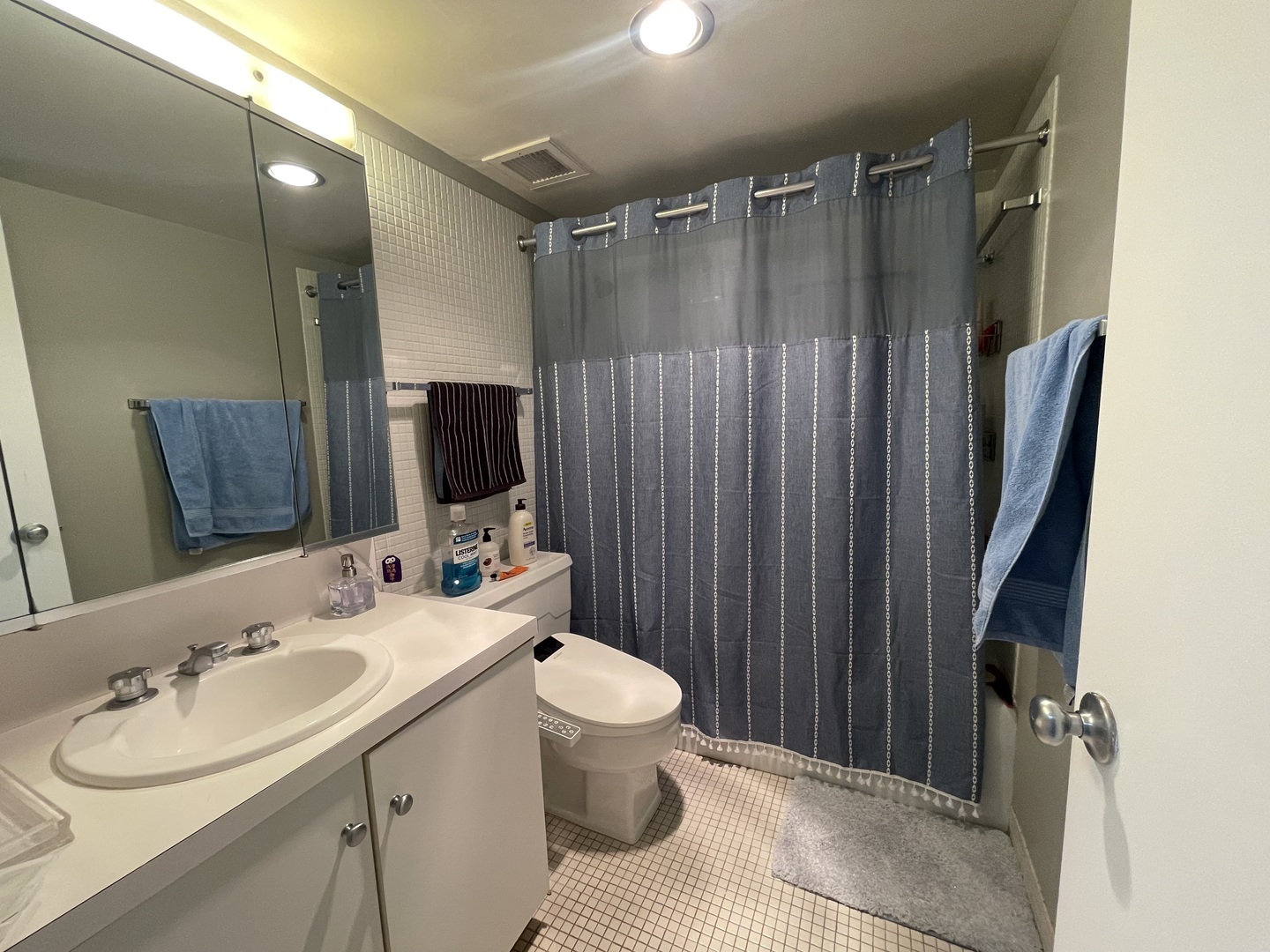 175 East Delaware Place, Unit 4503 Chicago, IL 60611 - Photo 17 of 26 a bathroom with a sink toilet double vanity and shower