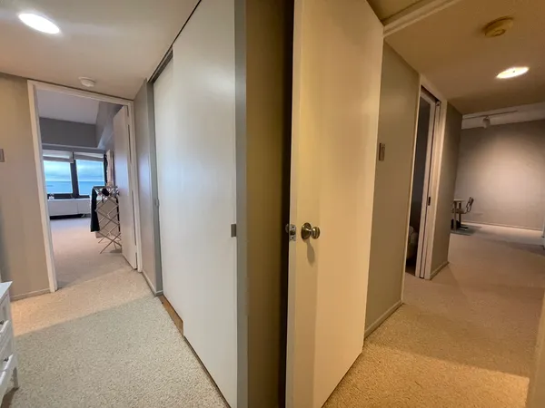a bedroom with a bed and a couch