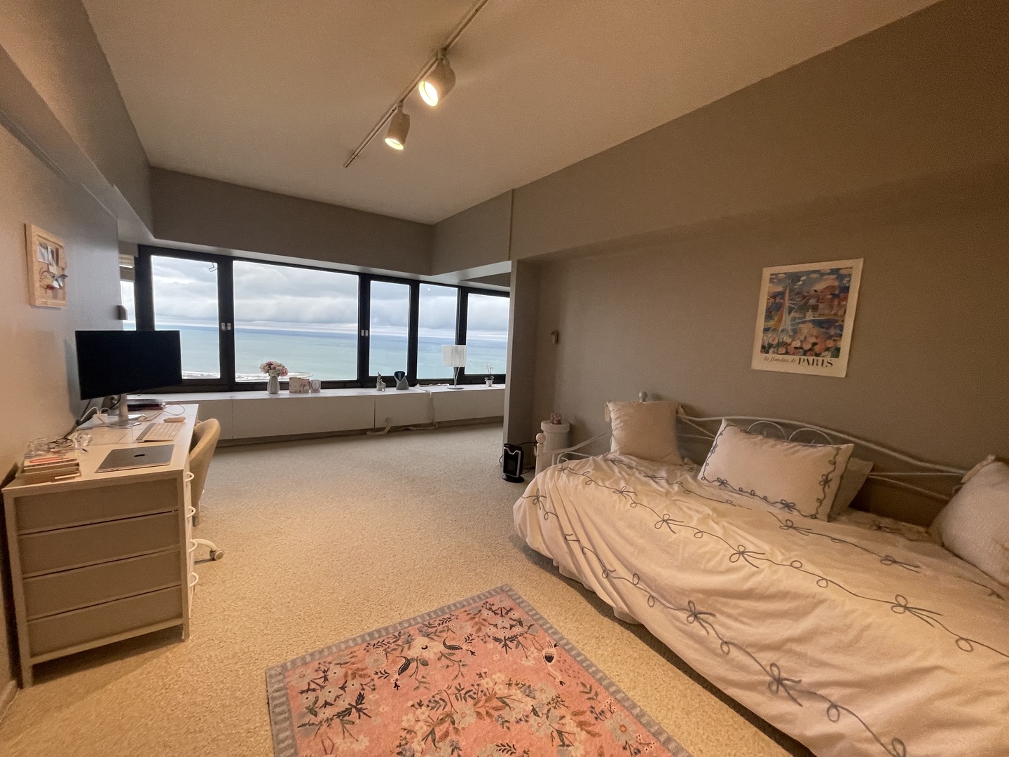 175 East Delaware Place, Unit 4503 Chicago, IL 60611 - Photo 22 of 26 a bedroom with a bed and a flat screen tv