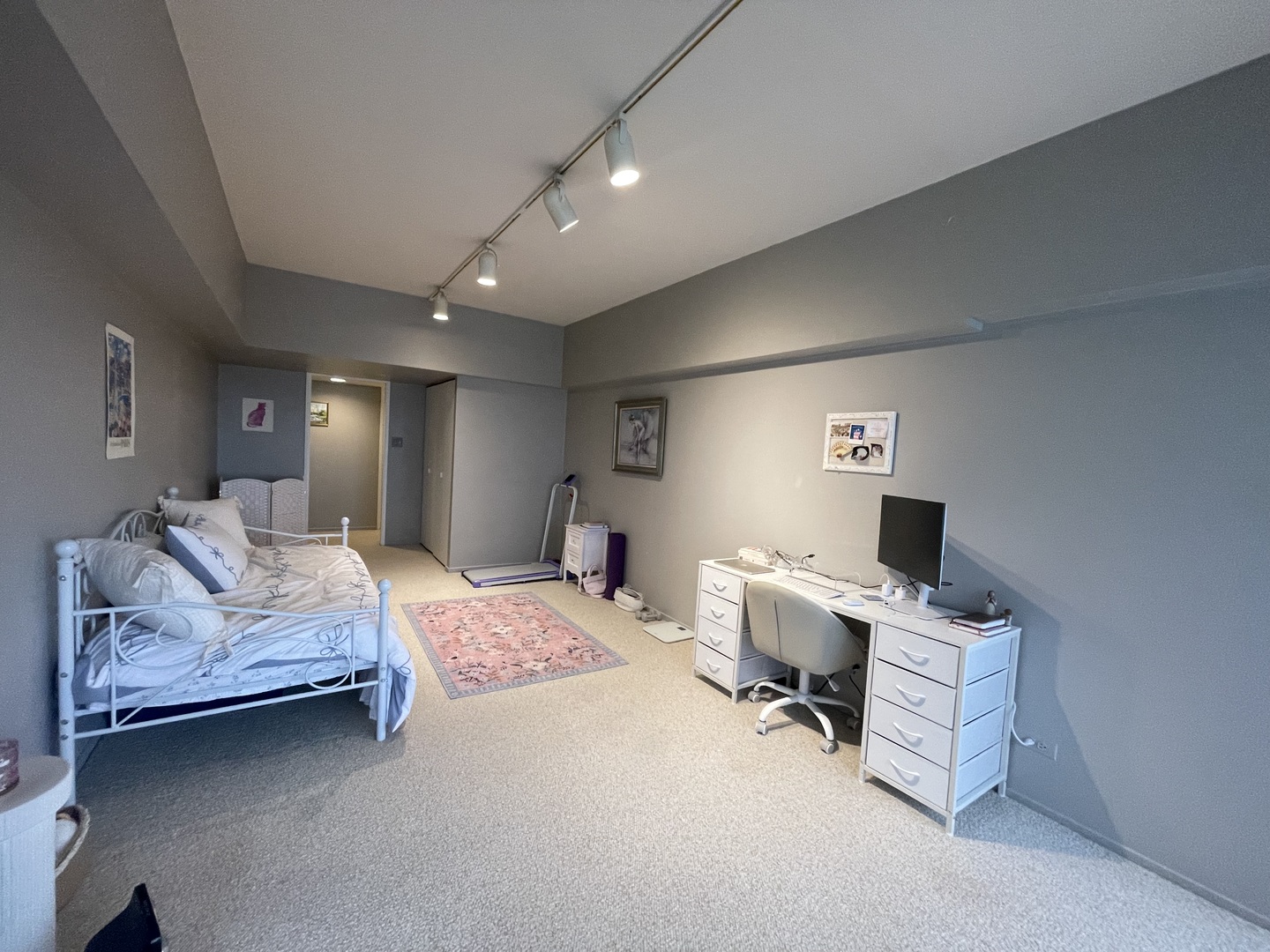 175 East Delaware Place, Unit 4503 Chicago, IL 60611 - Photo 23 of 26 a bedroom with a bed and a chandelier