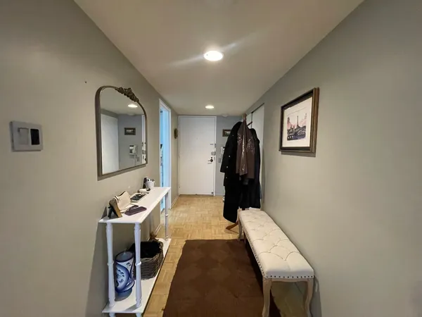 a living room with furniture a window and gym equipment