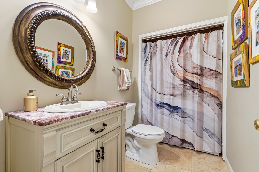 323 Sand Castle Lane St. Simons Island, GA 31522 - Photo 21 of 41 Powder bath w, washer & dryer behind curtian