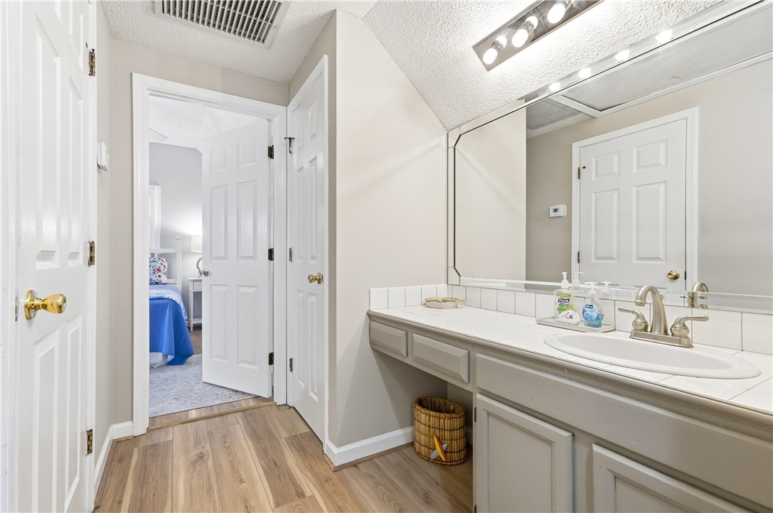 323 Sand Castle Lane St. Simons Island, GA 31522 - Photo 26 of 41 Upstairs hallway with second vanity