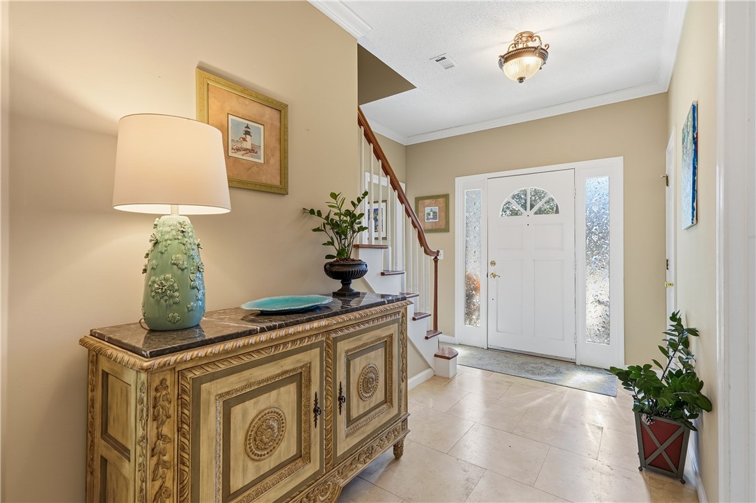 323 Sand Castle Lane St. Simons Island, GA 31522 - Photo 3 of 41 Foyer w/ coat closet