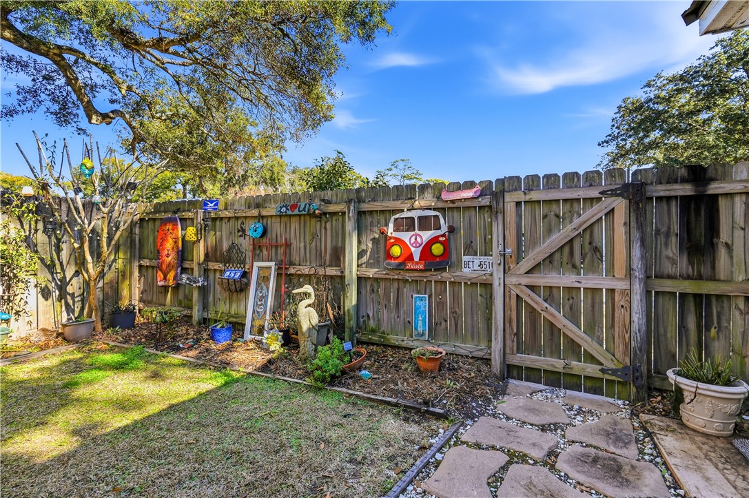 323 Sand Castle Lane St. Simons Island, GA 31522 - Photo 36 of 41 Gate to side street and driveway