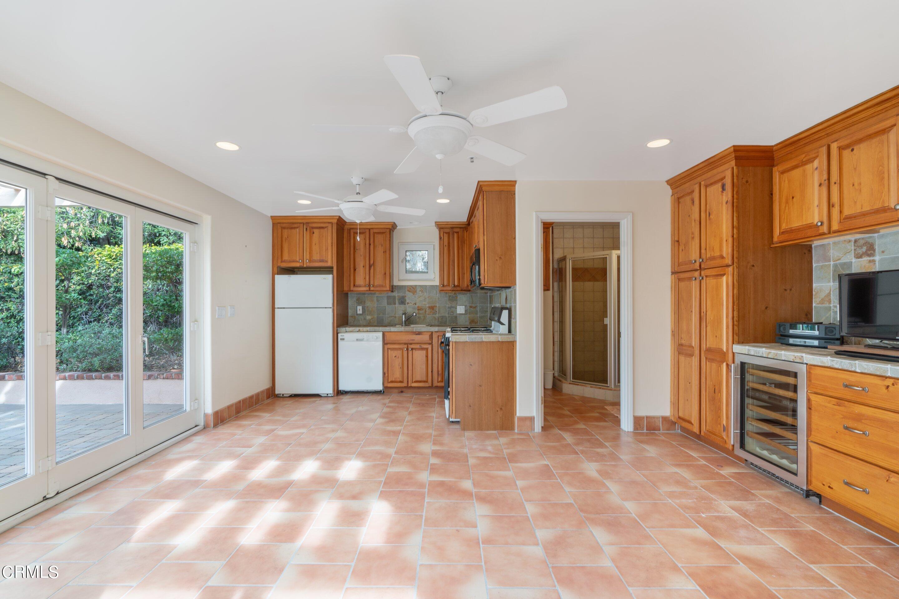 625 Cumberland Road Glendale, CA 91202 - Photo 15 of 73 a view of a kitchen with stainless steel appliances granite countertop a refrigerator and a stove top oven