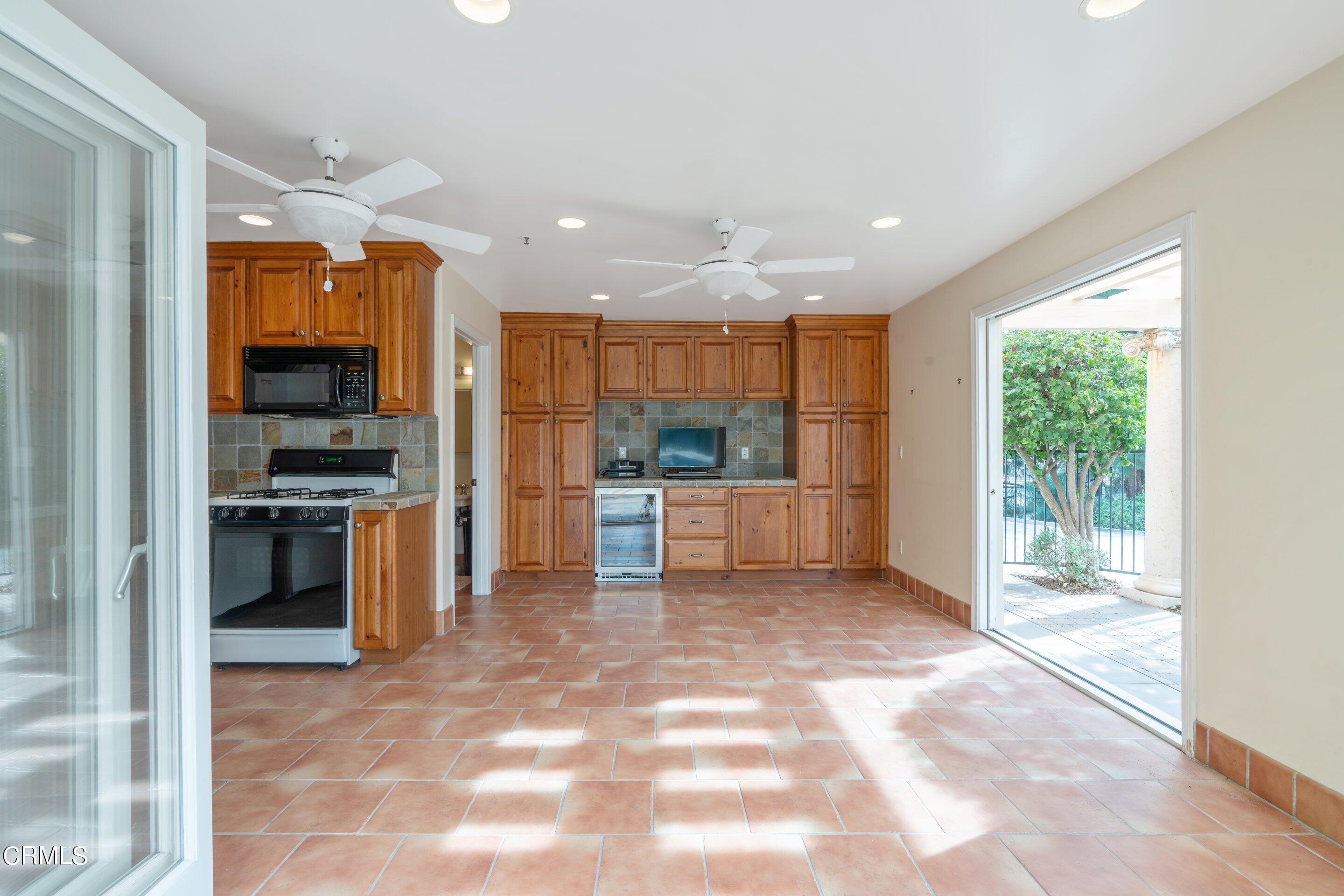 625 Cumberland Road Glendale, CA 91202 - Photo 16 of 73 a view of kitchen with kitchen island granite countertop a refrigerator and a sink