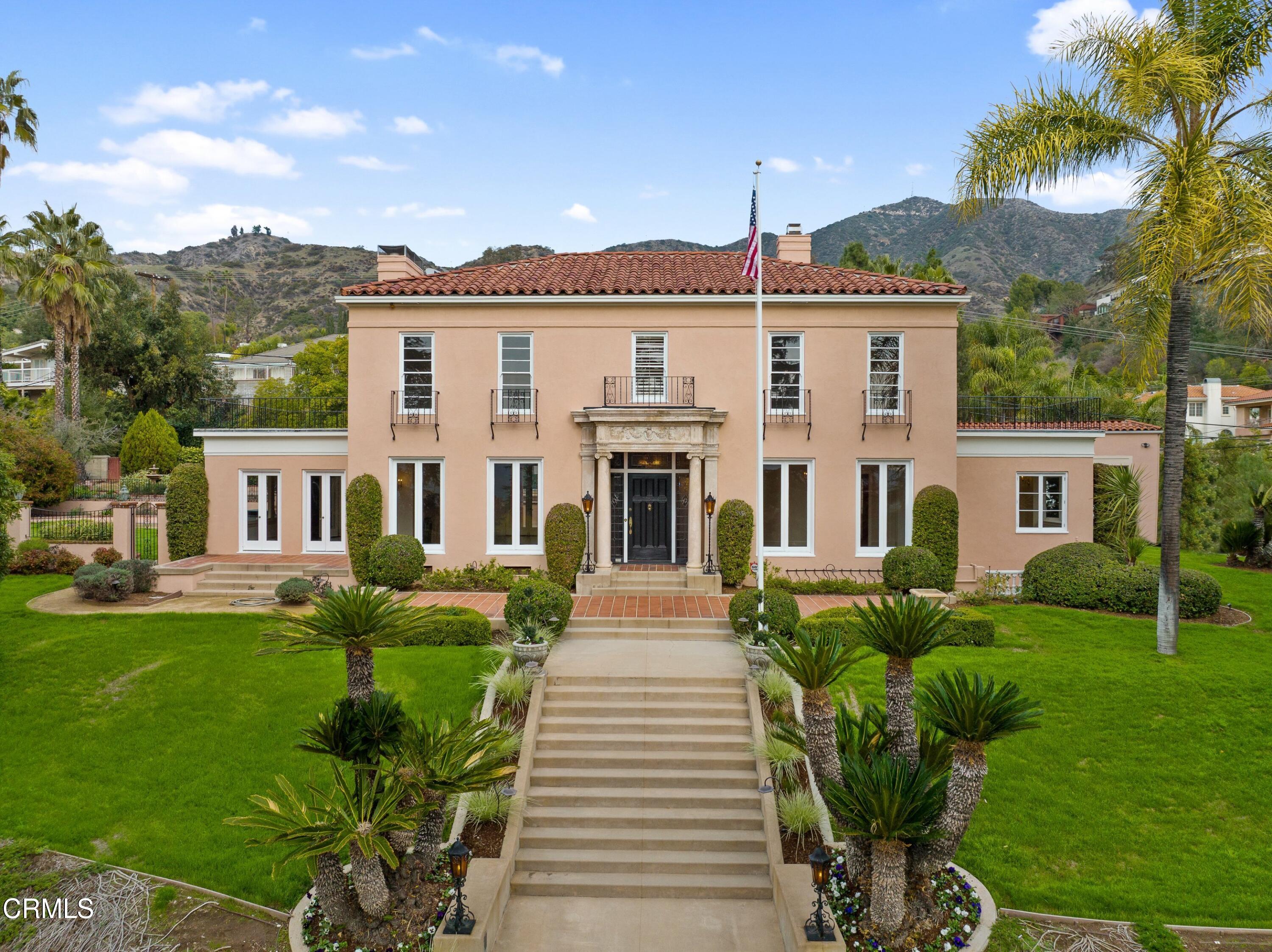 625 Cumberland Road Glendale, CA 91202 - Photo 2 of 73 a front view of a house with a yard table and chairs