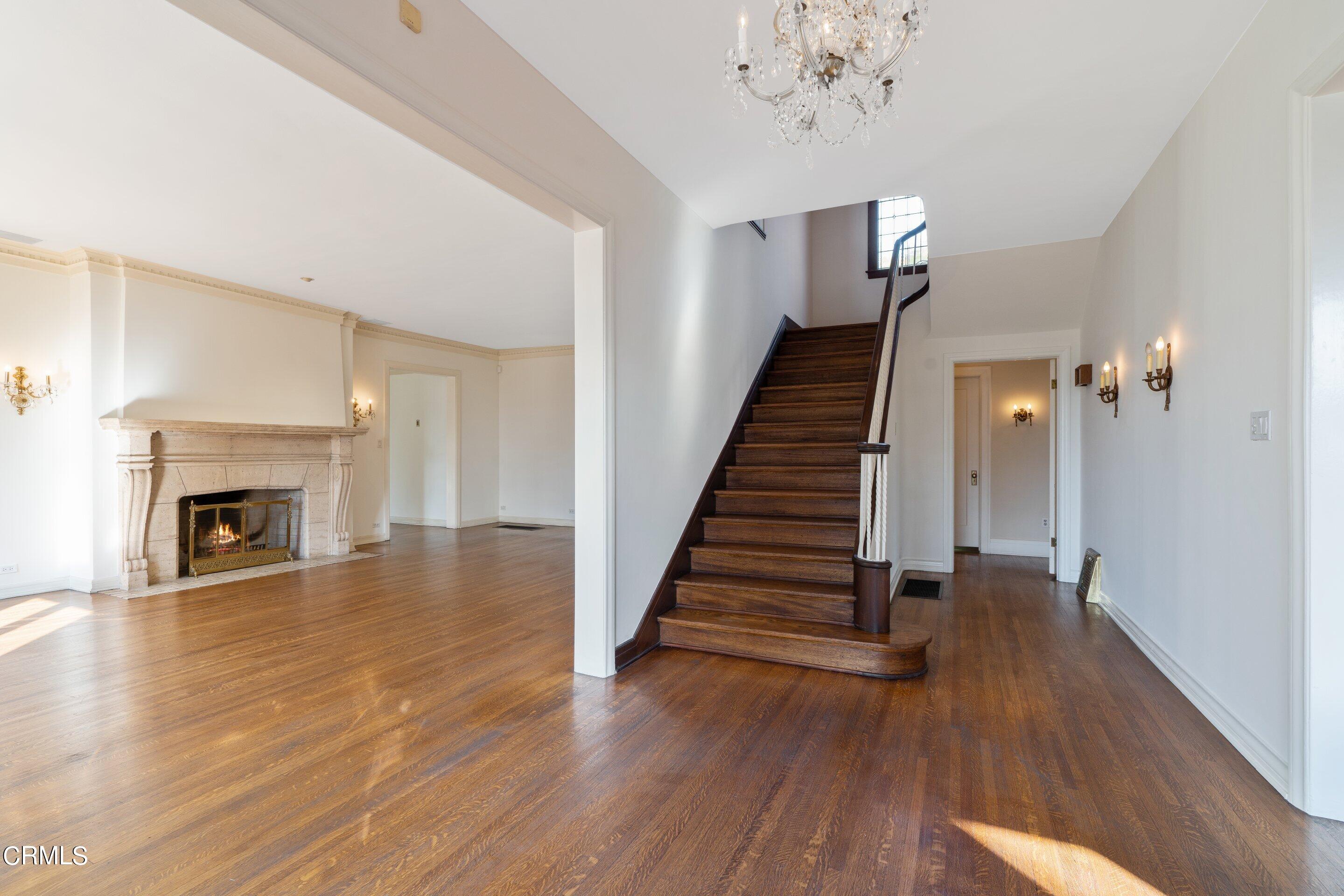 625 Cumberland Road Glendale, CA 91202 - Photo 24 of 73 a view of a livingroom with wooden floor and a fireplace