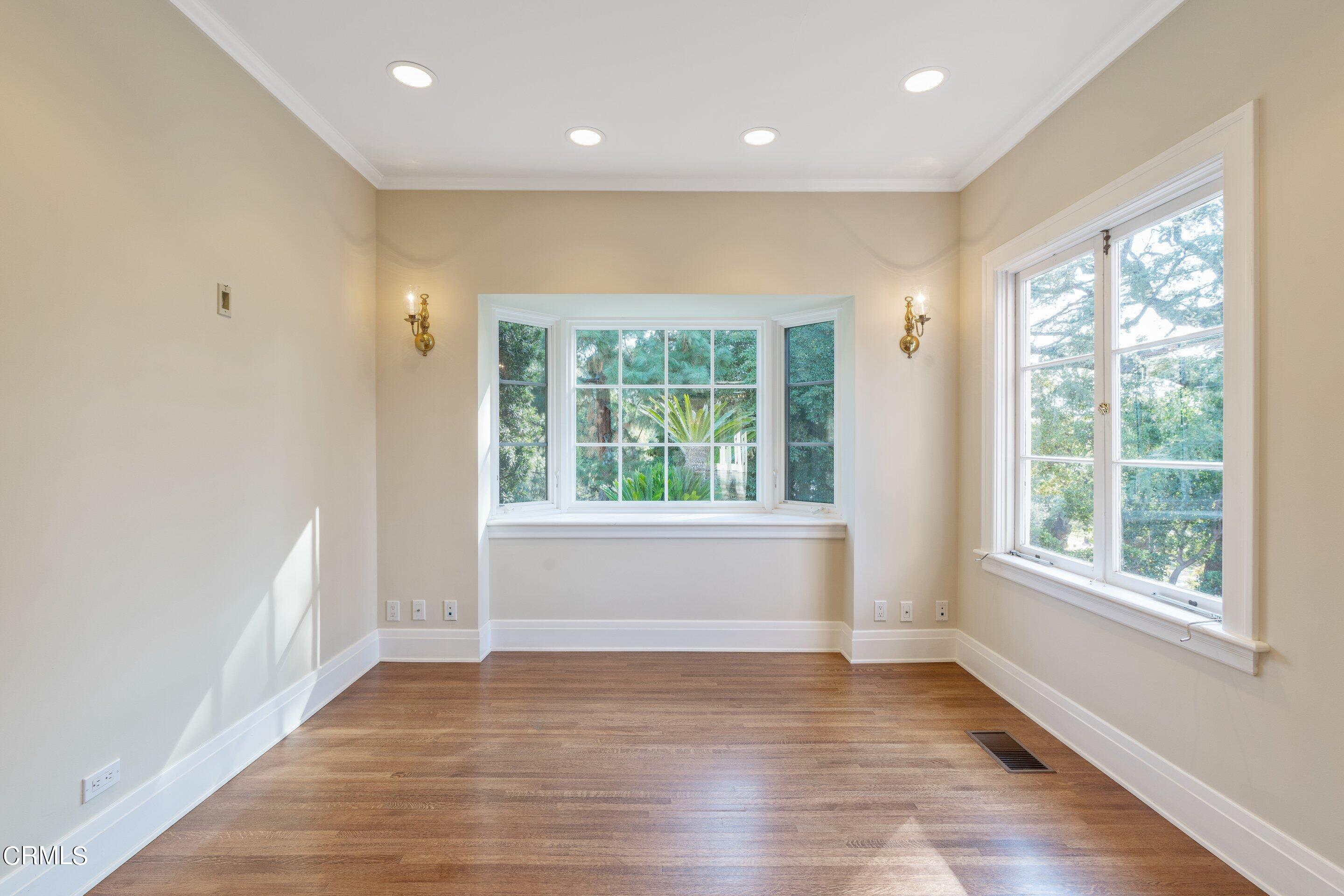 625 Cumberland Road Glendale, CA 91202 - Photo 33 of 73 a view of an empty room with wooden floor and a window