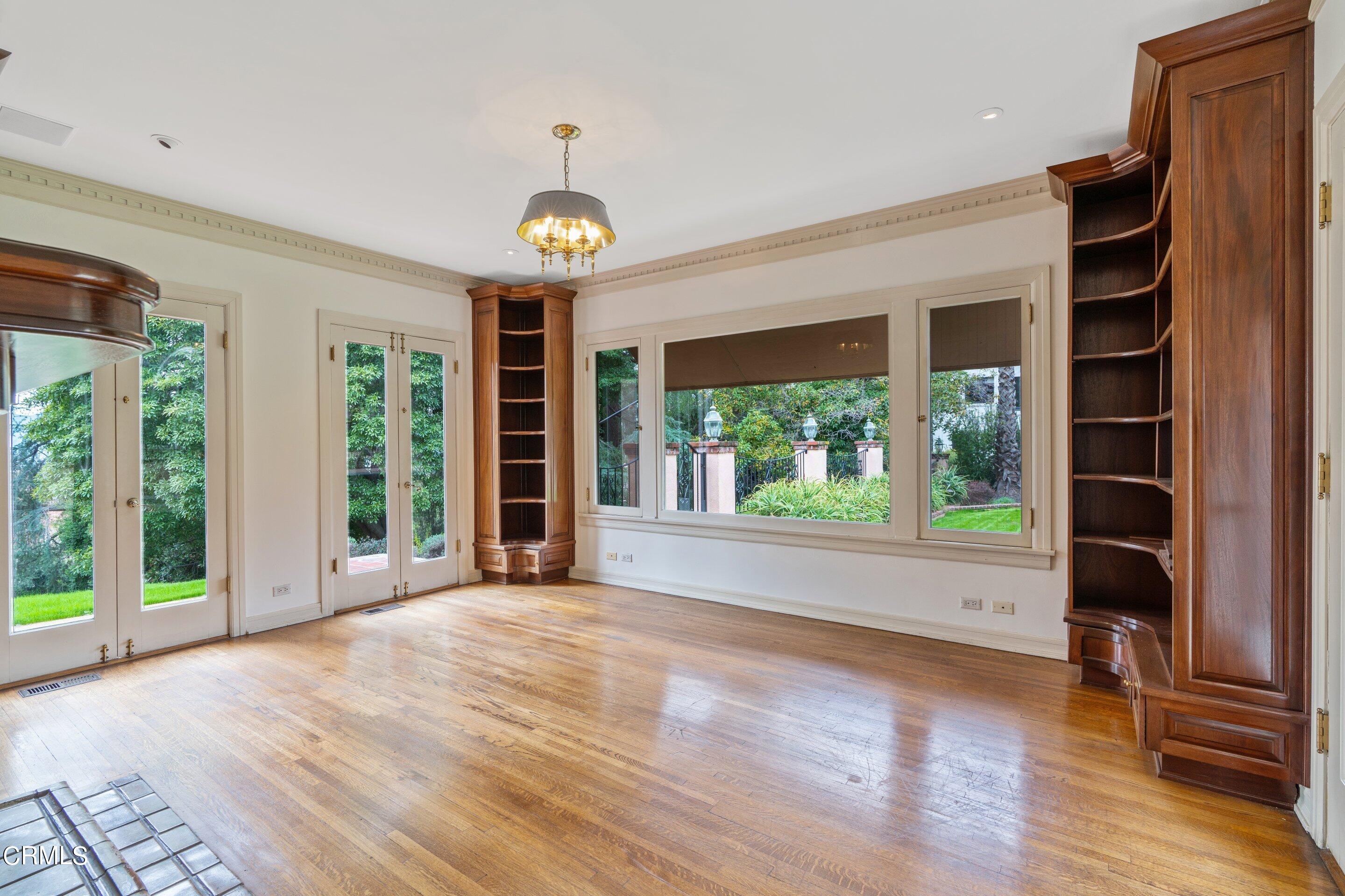 625 Cumberland Road Glendale, CA 91202 - Photo 46 of 73 a view of an empty room with a window and wooden floor
