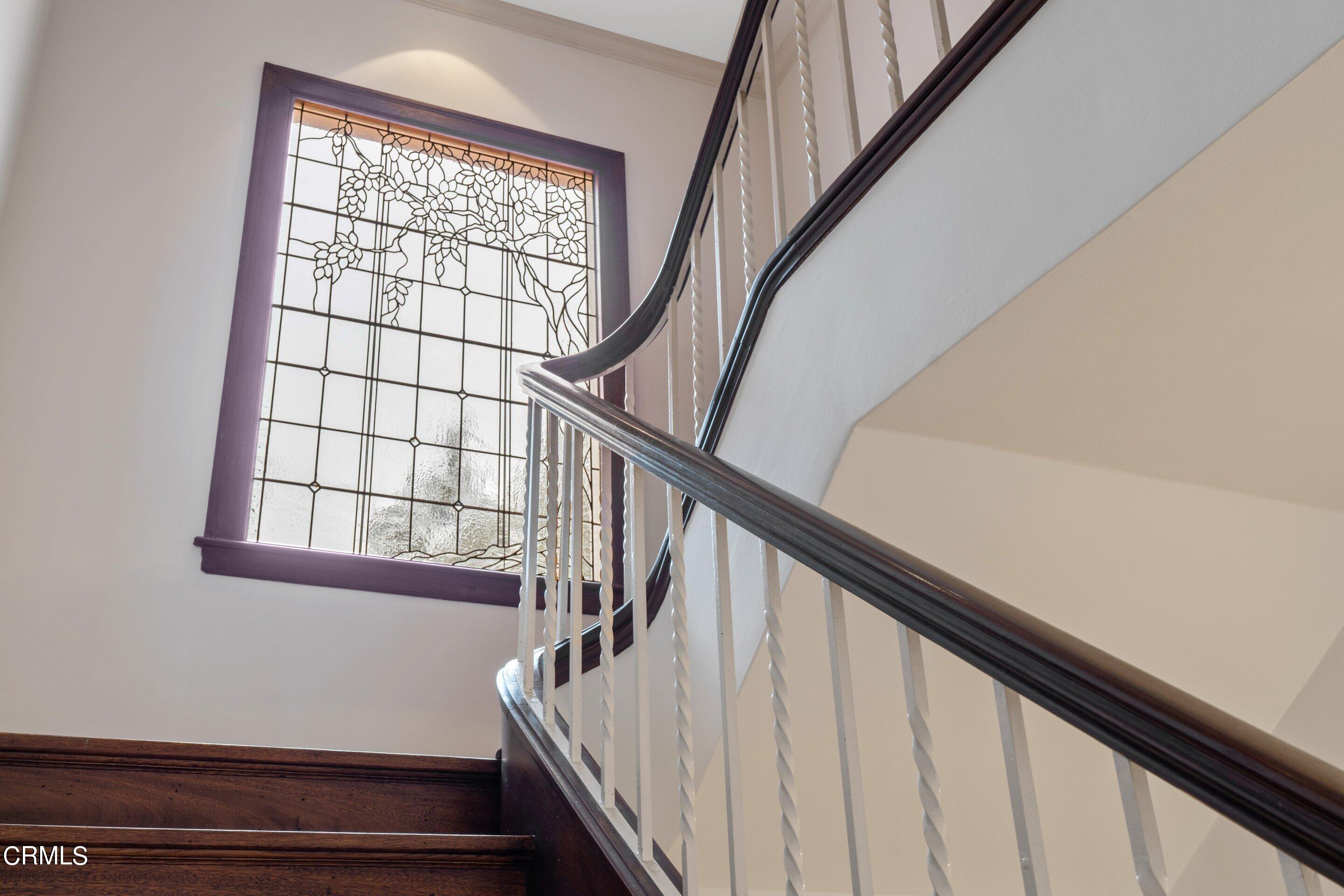 625 Cumberland Road Glendale, CA 91202 - Photo 47 of 73 a view of staircase with wooden floor and white walls