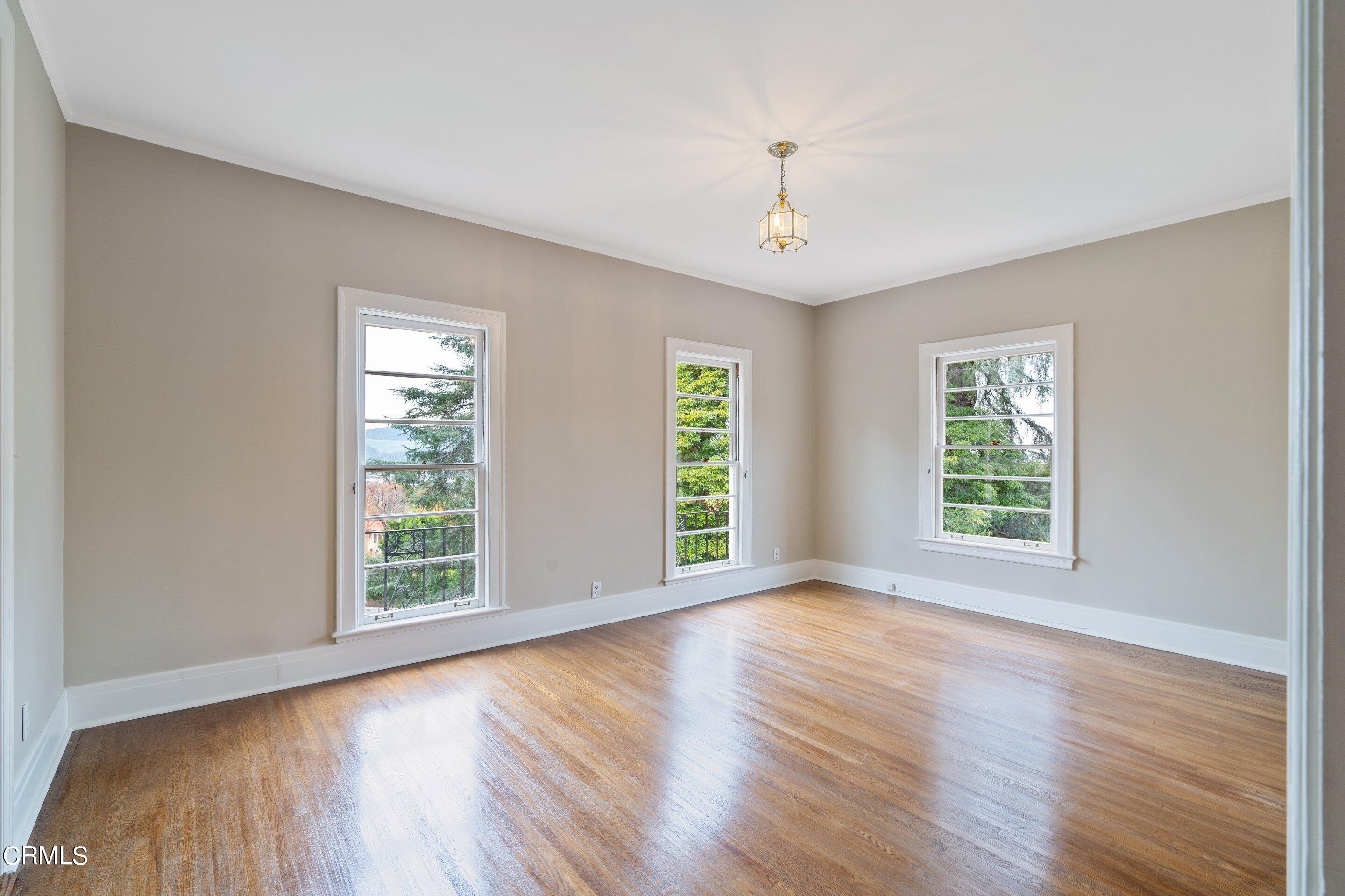 625 Cumberland Road Glendale, CA 91202 - Photo 54 of 73 a view of an empty room with wooden floor and a window