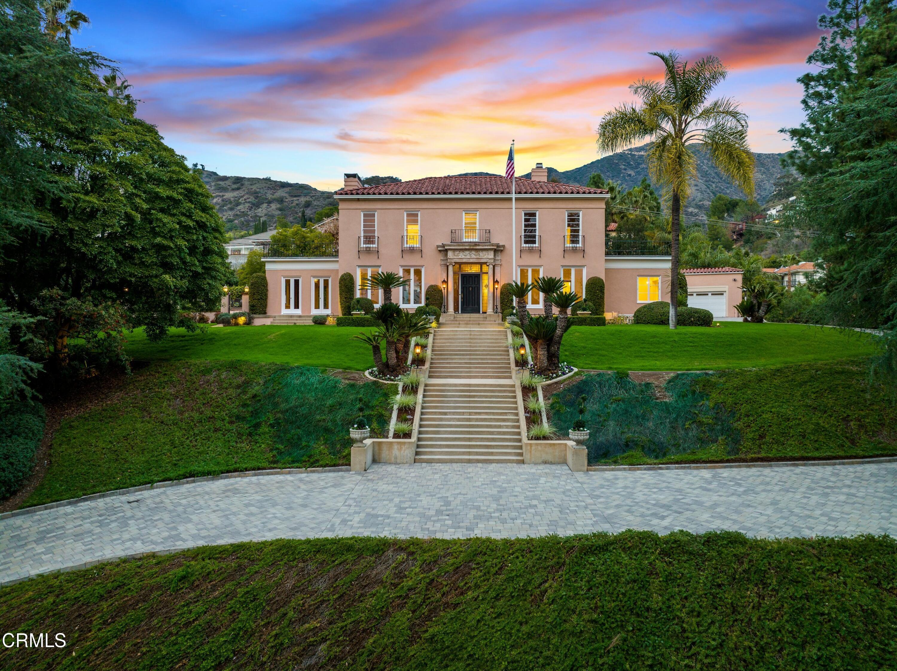 625 Cumberland Road Glendale, CA 91202 - Photo 62 of 73 a front view of a house with a yard and trees