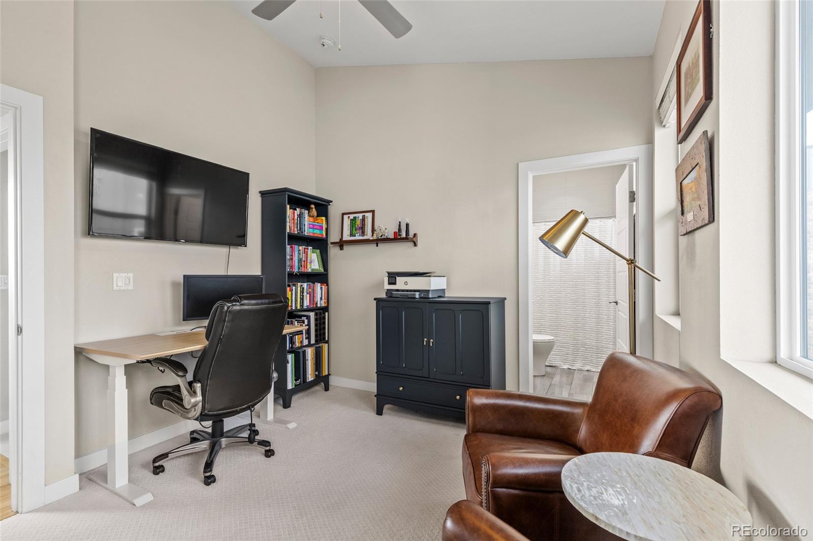 3553 South Emerson Street, Unit 2 Englewood, CO 80113 - Photo 15 of 31 a view of a livingroom with workspace and a couch
