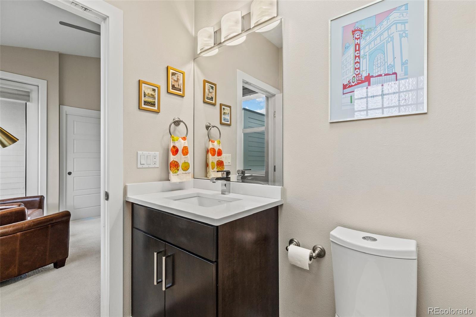 3553 South Emerson Street, Unit 2 Englewood, CO 80113 - Photo 18 of 31 a bathroom with a sink vanity mirror and toilet