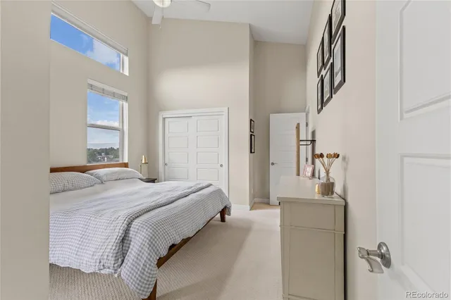 a bedroom with a bed and a mirror