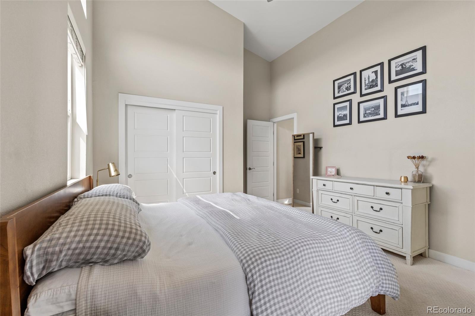 3553 South Emerson Street, Unit 2 Englewood, CO 80113 - Photo 20 of 31 a bedroom with a bed and a dresser