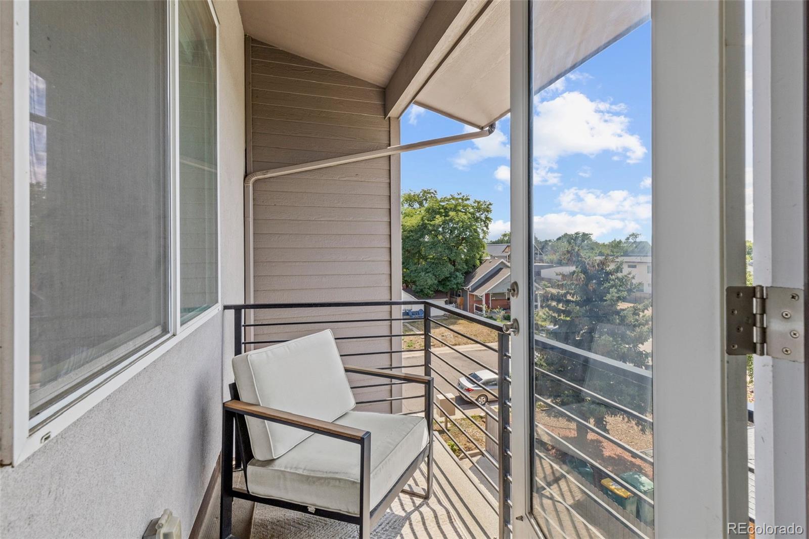 3553 South Emerson Street, Unit 2 Englewood, CO 80113 - Photo 22 of 31 a view of a balcony with chairs