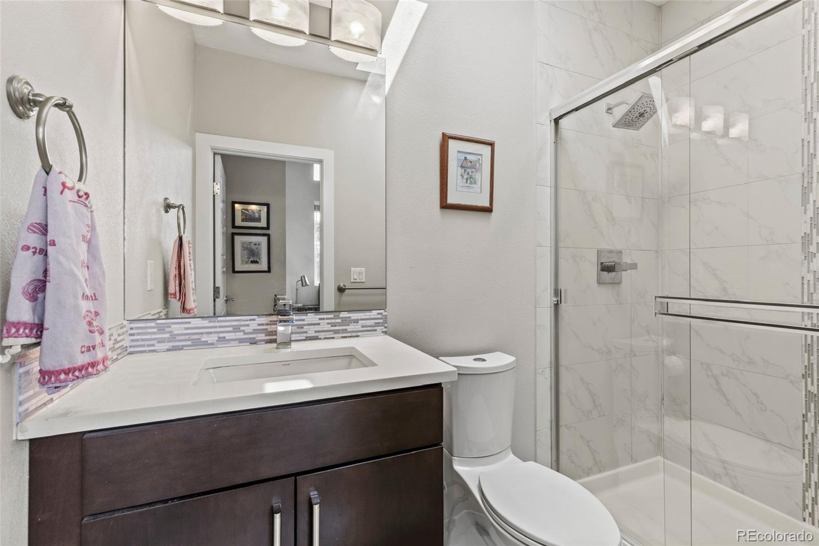 3553 South Emerson Street, Unit 2 Englewood, CO 80113 - Photo 23 of 31 a bathroom with a sink toilet and shower