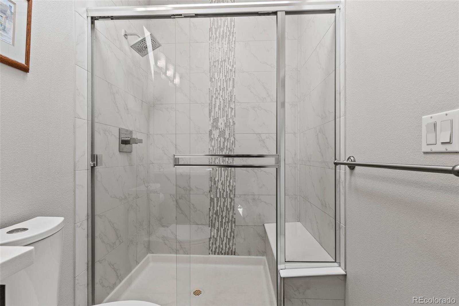 3553 South Emerson Street, Unit 2 Englewood, CO 80113 - Photo 24 of 31 a bathroom with a bathtub and a shower
