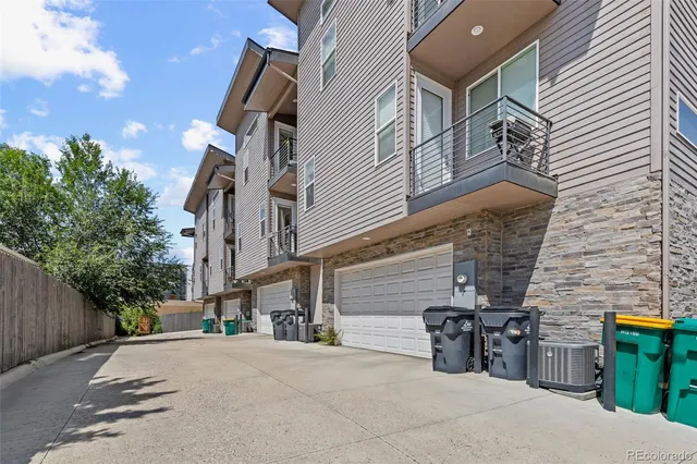 a view of a house with outdoor space and parking