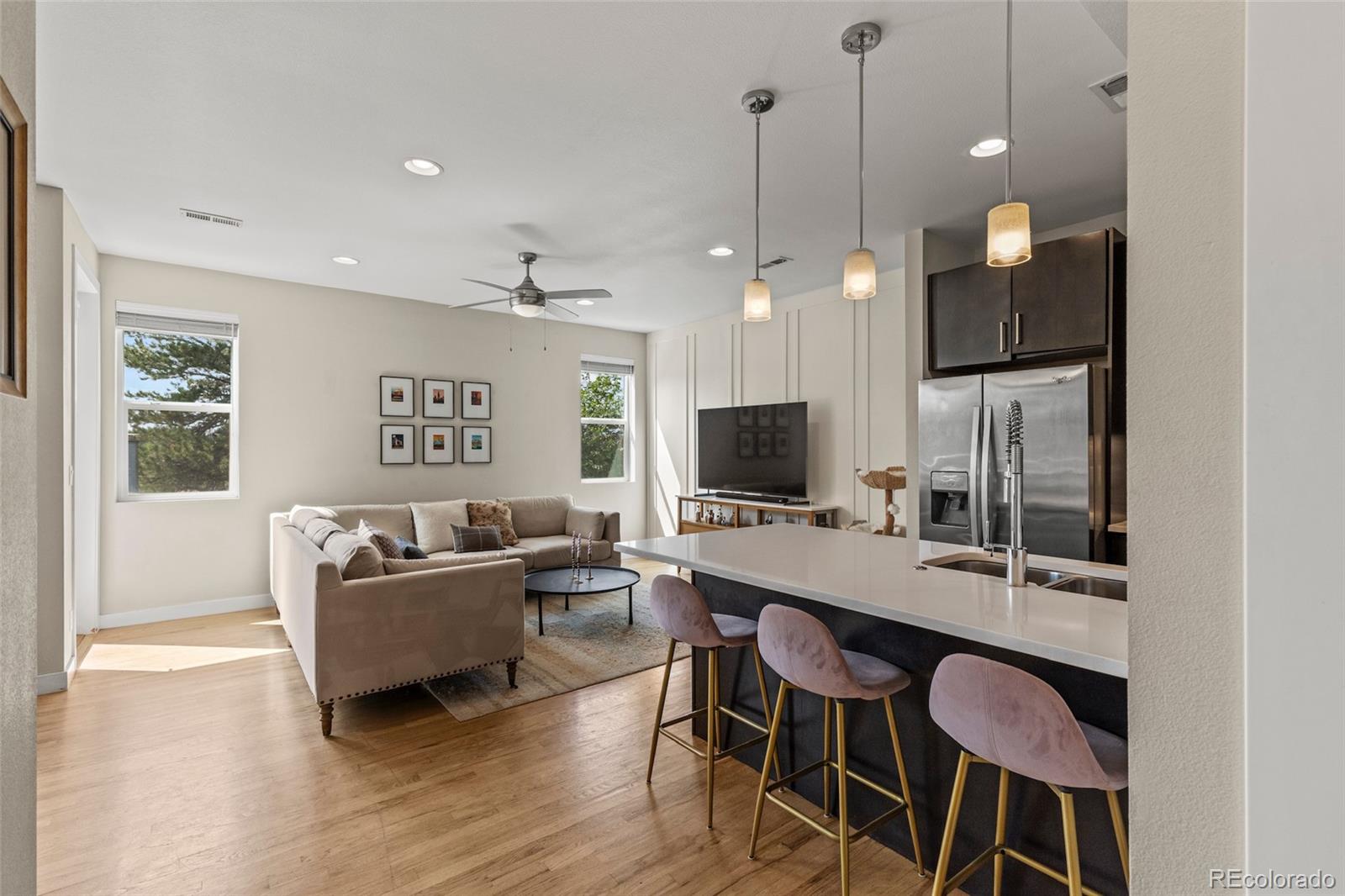 3553 South Emerson Street, Unit 2 Englewood, CO 80113 - Photo 4 of 31 a living room with furniture a window and a flat screen tv