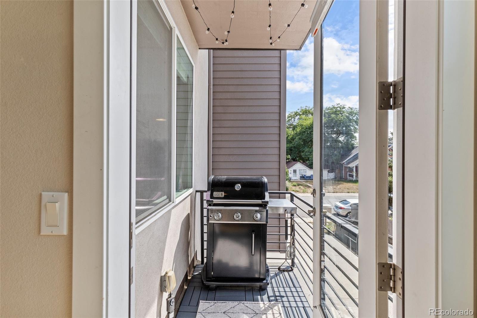 3553 South Emerson Street, Unit 2 Englewood, CO 80113 - Photo 7 of 31 a view of a hallway with a door and wooden floor