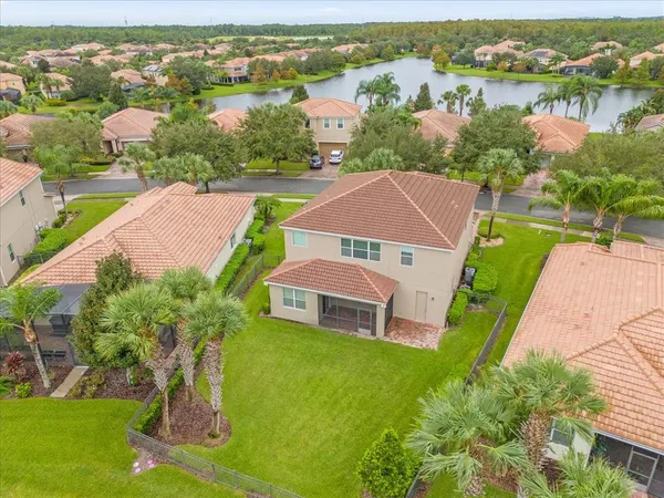 an aerial view of a house with outdoor space and pool view