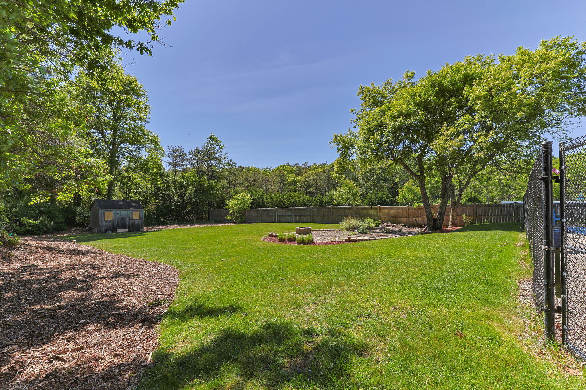 30 Sheffield Place Mashpee, MA 02649 - Photo 29 of 38 a view of a swimming pool with a yard