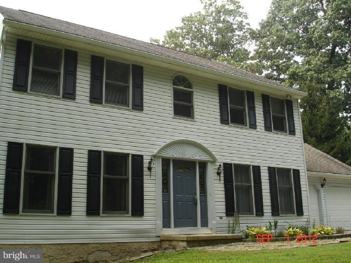 696 Guernsey Road South Landenberg, PA 19350 - Photo 1 of 25 a view of a house with a yard