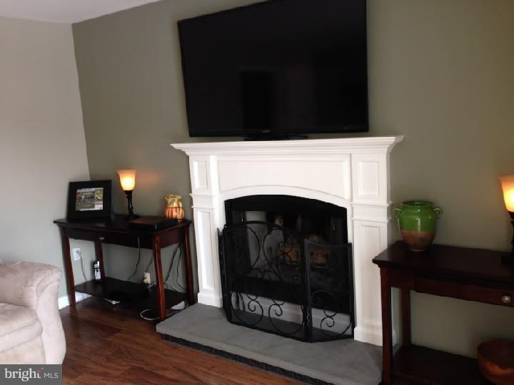 696 Guernsey Road South Landenberg, PA 19350 - Photo 11 of 25 a living room with furniture and a fireplace