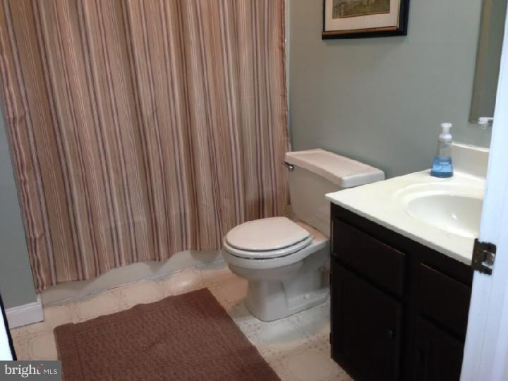 696 Guernsey Road South Landenberg, PA 19350 - Photo 16 of 25 a bathroom with a sink and a toilet